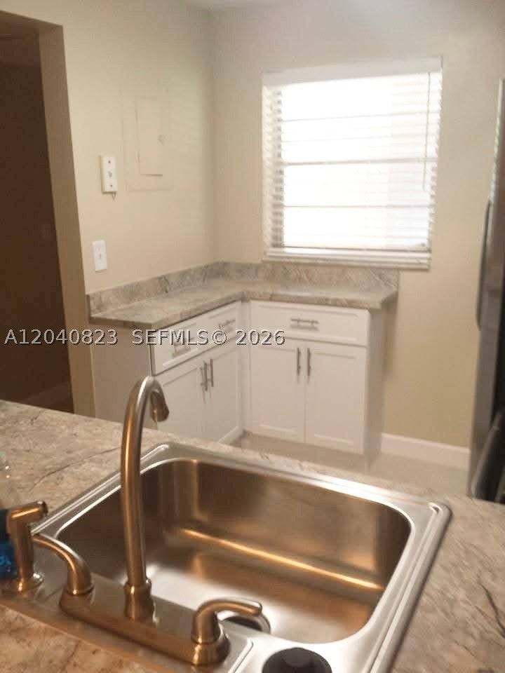 Photo of 9235 Lagoon Pl #109, Davie, FL 33324 (MLS # A12040823)