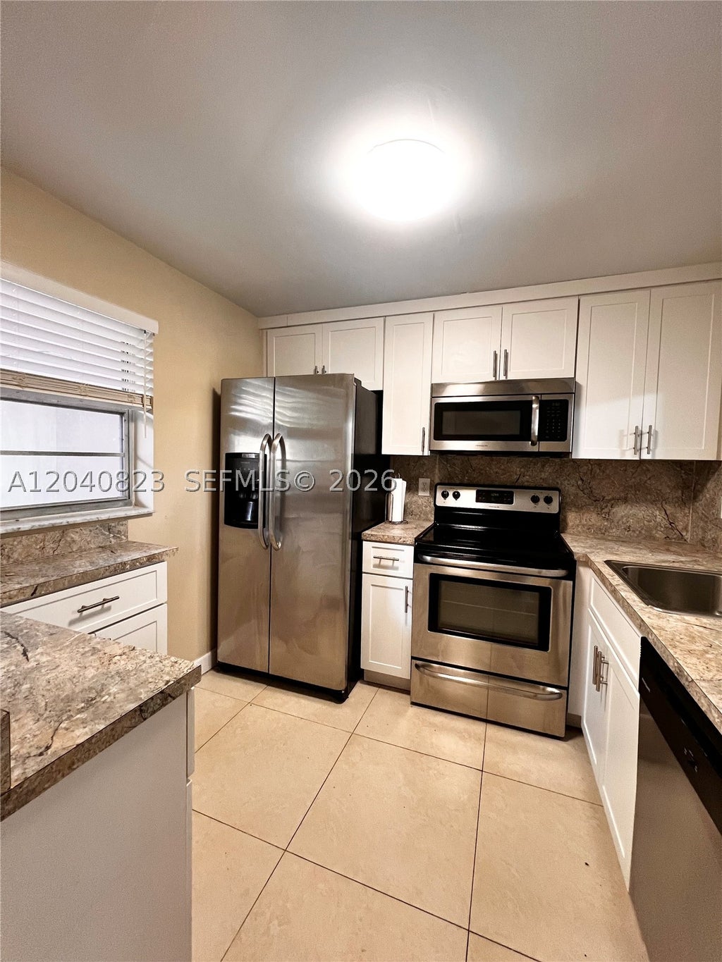Photo of 9235 Lagoon Pl #109, Davie, FL 33324 (MLS # A12040823)