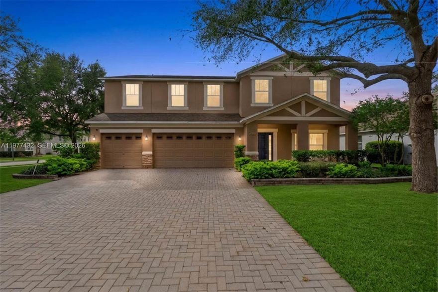 Nestled on a corner lot — third of an acre in the gated Wekiva Run community, this 5-bedroom, 3-bath residence delivers over 3,200 square feet of well-designed living space with the kind of room that's hard to find at this price point. The paver driveway leads to an oversized 3-car garage — and a covered front porch framed by mature landscaping and established oaks.

Inside, the main level opens to an expansive living and dining area with tile floors and soaring sightlines into the chef's kitchen. Granite countertops wrap the generous island and breakfast bar, complemented by rich wood cabinetry, and stainless steel appliances. The kitchen flows directly into the family room — an open-concept layout built for the way families actually live.

Upstairs, the primary suite spans nearly 24 by 15 feet with a walk-in closet and a spa-inspired bath featuring a soaking tub, glass-enclosed walk-in shower, and dual vanity. Four additional bedrooms offer generous proportions, and a large recreational room provides flexible space for a media lounge, home office, or game room.

The fully fenced backyard — vinyl privacy fencing on a corner — offers a blank canvas for a future pool, or outdoor kitchen. A covered lanai overlooks the yard with mature trees providing natural shade and privacy. Wekiva Run offers gated entry, sidewalks, a community park and playground. Select photos have been virtually staged to illustrate the home's potential, including backyard pool rendering.
