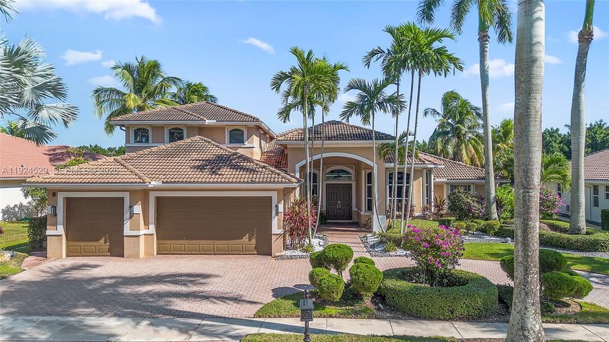 Located in the gated community of Victoria Isle in Weston Hills CC, this elegant Mystic model offers 5 bedrooms, a loft, an office, and 5.5 baths on an oversized, lushly landscaped lot. Marble floors flow through the main living areas, and the kitchen features wood cabinetry, granite counters, a center island, GE Profile appliances, and double ovens. The screened patio is ideal for entertaining, featuring a commercial-grade built-in grill, an outdoor kitchen, and long lake views. The saltwater pool, travertine deck, and screen enclosure create a serene outdoor retreat. Additional features include original travertine flooring, extensive crown molding, zebra blinds, accordion protection, four Rheem A/C units, a Rheem pool heater, and a fenced side patio perfect for pets. An ADT-monitored alarm system and an Arlo doorbell camera secure the home. The 3-car garage currently includes a permitted flex space for your lifestyle. Walking distance to Victoria Pointe Park and minutes from A+ schools and Weston Town Center, this home offers luxury, comfort, and an unbeatable location.