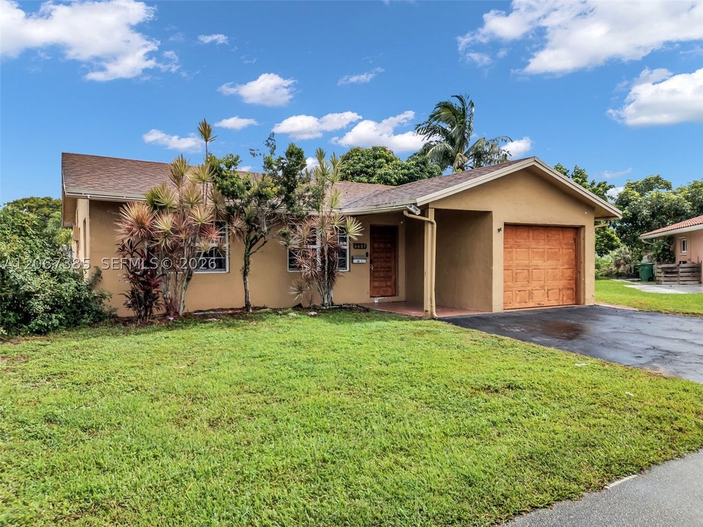 Photo of 6605 NW 77th St, Tamarac, FL 33321 (MLS # A12067385)