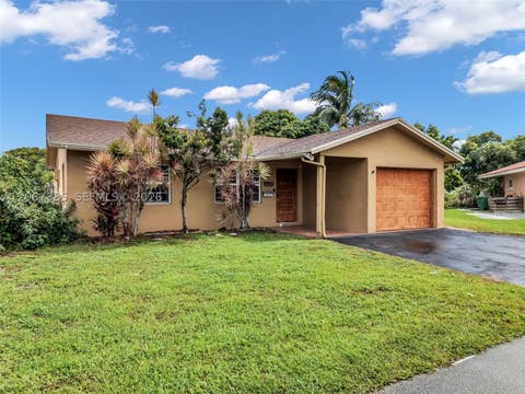 Photo of 6605 NW 77th St, Tamarac, FL 33321 (MLS # A12067385)