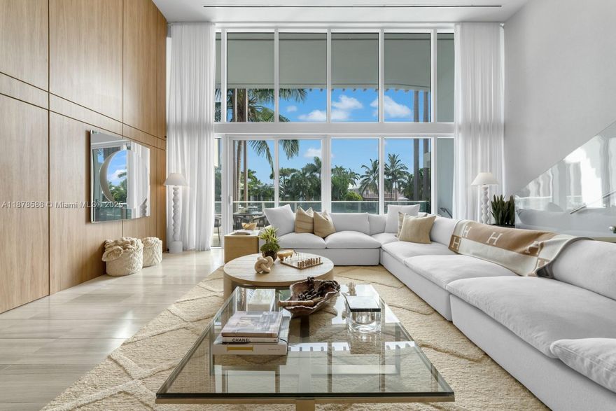 Bring your boat & live in luxury at The Ritz-Carlton Miami Beach with your own private 40’ boat slip just outside your residence. This 2BD/2.5BA waterfront home features soaring 16’ ceilings & walls of glass that flood the open floor plan. A sleek black marble kitchen & wine cellar makes entertaining seamless. Over 1,400 SF of outdoor living includes a balcony, terrace, summer kitchen, jetted jacuzzi, & spacious lounge/dining areas—perfect after a day on the water. The entry-level primary suite offers a spa-like retreat, while the upstairs guest suite includes a workspace. Elegant finishes include emerald herringbone tile, custom millwork, & designer lighting. Residents enjoy world-class Ritz-Carlton amenities: resort-style pools, fitness center, entertainment lounges & concierge service.