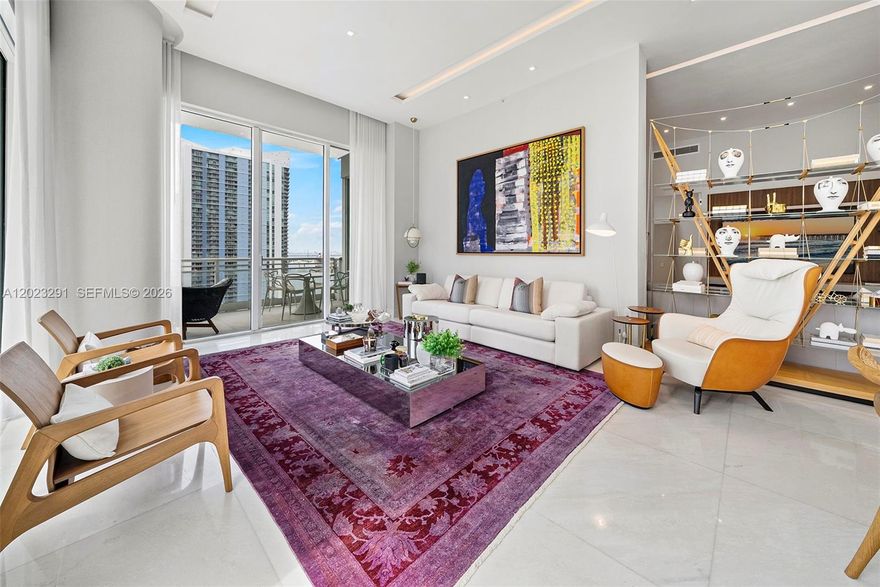 Exceptionally remodeled and designer-appointed by renowned designer Luciana Fragali, this stunning 3-bedroom, 3.5-bath corner residence at Asia Brickell Key offers an elevated level of contemporary luxury within one of Miami’s most exclusive waterfront addresses. A private elevator foyer opens to expansive interiors with 12-foot ceilings, floor-to-ceiling glass openings, and breathtaking panoramic views of Biscayne Bay, the Miami River, and the city skyline. Thoughtfully redesigned with bespoke finishes and impeccable attention to detail, the residence blends timeless sophistication with modern comfort. The gourmet kitchen features premium appliances, custom cabinetry, and refined quartz surfaces, seamlessly integrated into the open living and dining areas ideal for both entertaining and everyday living. Spa-inspired bathrooms, custom millwork, marble and oak wood flooring, motorized blinds, designer lighting, and curated finishes throughout, elevate the residence’s refined contemporary aesthetic. Wraparound terraces invite seamless indoor-outdoor living while capturing stunning sunrise and sunset views from multiple exposures. The unit includes 2 assigned parking spaces and a large private storage unit. Asia residents enjoy a boutique lifestyle with 24-hour concierge, valet and security, resort-style pool and spa, tennis court, fitness center, exclusive privacy within the gated island community of Brickell Key, steps from Miami’s finest dining, shopping, and entertainment.