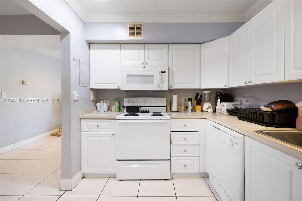 Photo of 4848 NW 24th Ct #215, Lauderdale Lakes, FL 33313 (MLS # A11975113)