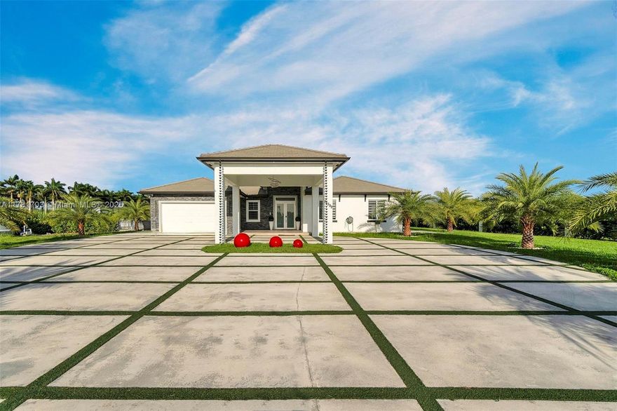 This magnificent 5-bedroom 4 Bathrooms estate sits on nearly 2 acres of lush paradise, surrounded by 50 majestic, imported Canary Islands date palms. A true sanctuary with privacy, luxury and income potential. Resort Style pool with gazebo with full outdoor kitchen and extra-large cabana with a brand-new fitness room and state of the art generator. TOTAL COMFORT RAIN OR SHINE. Smart Home Tech, Impact windows and doors, soaring ceilings with custom lightning. Open concept kitchen with top-tier stainless steel appliances. Large two car garage with plus spacious carport. zoning allows for: stables, nurseries, fruit trees and more ---create your dream. This is an income producing property with an income producing business included