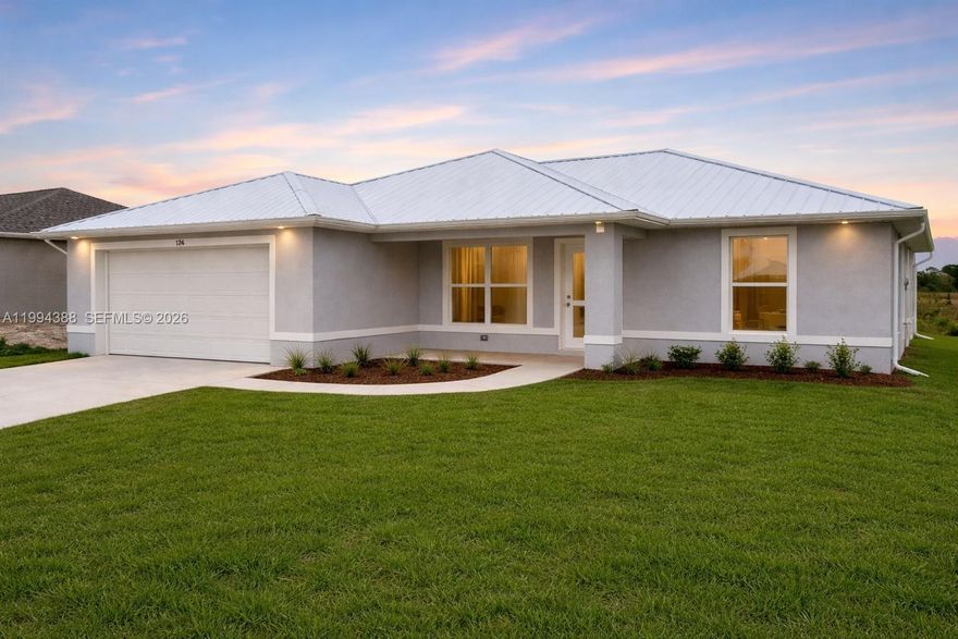 New construction home in LaBelle, built in 2023 and move-in ready. This 3-bedroom, 2-bathroom property features an open-concept layout with a modern kitchen, granite countertops, stainless steel appliances, and abundant natural light. Spacious living and dining areas with wood-style flooring throughout.

Situated on a generously sized lot with ample outdoor space and potential for customization or expansion.

Upgraded with spray foam insulation in the attic for improved energy efficiency and indoor comfort. Impact-resistant windows and doors provide added durability and protection.

Additional features include a metal roof and tankless water heater. Conveniently located just minutes from Highway 80 in the growing Banyan Village community.