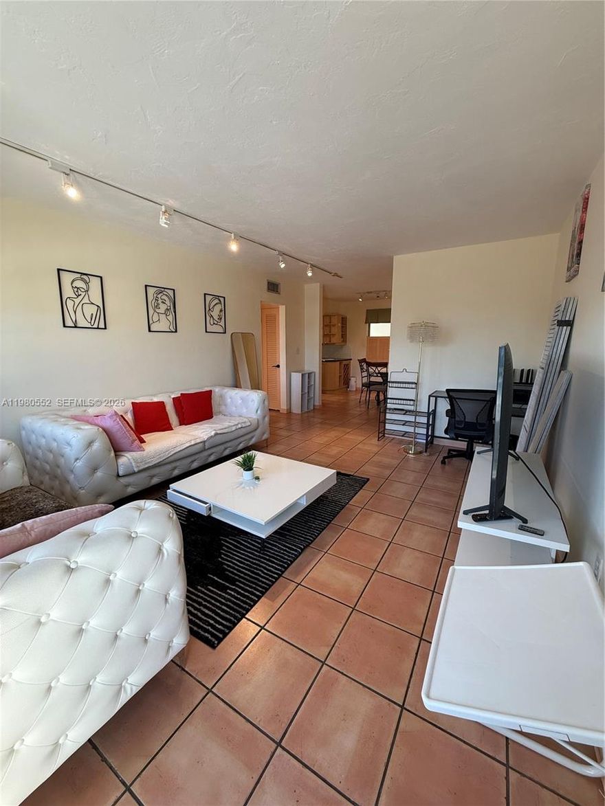 Top-floor Corner unit featuring a full-size washer and dryer inside the unit, private balcony with northern views, and impact windows throughout. The apartment includes one assigned gated and covered parking space, elevator access, and central A/C for year-round comfort.  The unit can be rented furnished or unfurnished, offering flexibility to suit your needs. Clean, well-maintained, and move-in ready.  Secured access building.  Easy to show!  Walk to Lincoln Road, the beach, Restaurants and shops.  Pets considered.