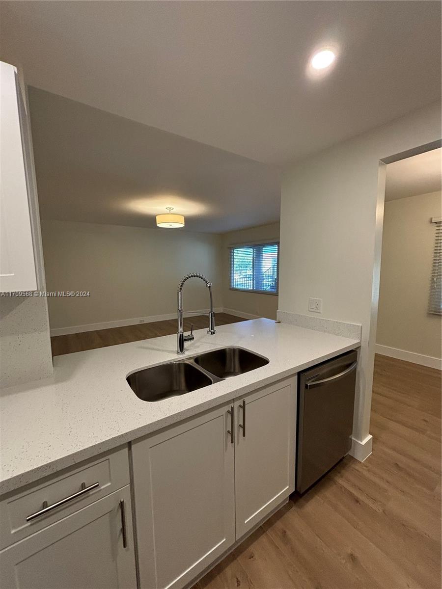 Gorgeous spacious & fully remodeled 2/2 condo. Enjoy the view from your balcony, with top to bottom Impact Windows overlooking the Golf Course and lake. Unit features impact windows through-out, brand new kitchen cabinets w/SS appliances & quartz countertop. Bathrooms completely renovated. Also, all new flooring throughout. Freshly painted, new window treatments installed and NO POPCORN ceiling here! Washer & dryer short walk from unit. There is one assigned parking & plenty of guest parking. HOA includes water, cable, internet, and endless amenities. Million-dollar clubhouse, gyms, pools, theater, transportation and much more. Excellent location, near major shopping malls, restaurants and major highways. Building scheduled to be painted in the next few weeks.