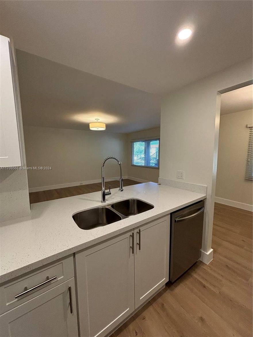 Gorgeous spacious & fully remodeled 2/2 condo. Enjoy the view from your balcony, with top to bottom Impact Windows overlooking the Golf Course and lake. Unit features impact windows through-out, brand new kitchen cabinets w/SS appliances & quartz countertop. Bathrooms completely renovated. Also, all new flooring throughout. Freshly painted, new window treatments installed and NO POPCORN ceiling here! Washer & dryer short walk from unit. There is one assigned parking & plenty of guest parking. HOA includes water, cable, internet, and endless amenities. Million-dollar clubhouse, gyms, pools, theater, transportation and much more. Excellent location, near major shopping malls, restaurants and major highways. Building scheduled to be painted in the next few weeks.