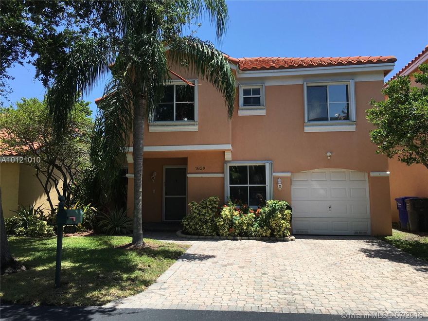 Fabulous opportunity to own just blocks from Hollywood Beach!  This fabulous single family home with gorgeous lake view has been beautifully updated!  New flooring, freshly painted, updated eat-in kitchen with wood cabinets & granite counters.  Formal dining & family room over-look fabulous view.  Dramatic volume ceilings.  Huge screened patio is perfect for family time or entertaining.  New A/C.  Accordion shutters are a huge plus!  Yard for kids & or pets.  Over-sized garage!  Nothing to do but move in!