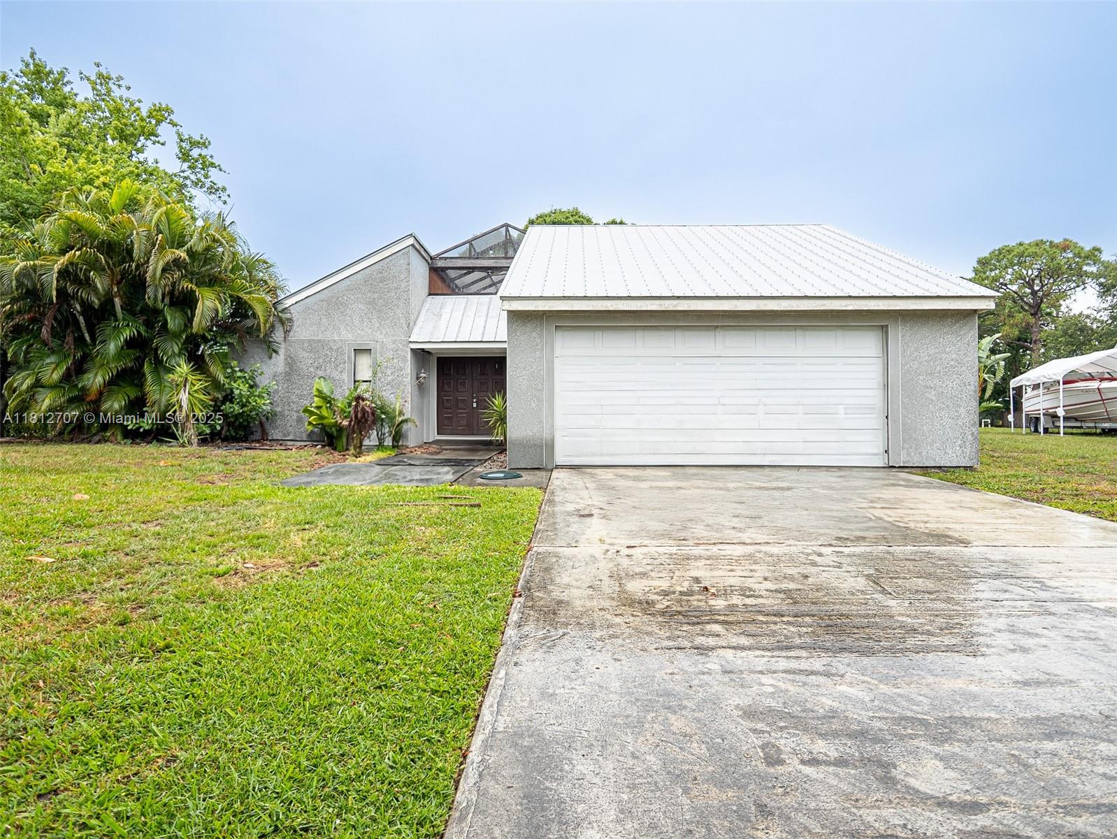 Amazing 3/2 home located in Port St. Lucie Florida, only minutes for the beach. This amazing home offers an open concept and plenty of yard space for large family gatherings, adding a pool or adding a large garden. This gem is centrally located near of the best schools, shopping, and beaches. The unique design of the home surrounds the outdoor patio area, great for eating outdoors and enjoying the Florida weather. Come by today and makes this home yours!!!