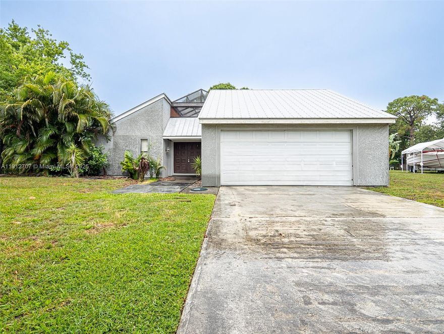 Amazing 3/2 home located in Port St. Lucie Florida, only minutes for the beach. This amazing home offers an open concept and plenty of yard space for large family gatherings, adding a pool or adding a large garden. This gem is centrally located near of the best schools, shopping, and beaches.  The unique design of the home surrounds the outdoor patio area, great for eating outdoors and enjoying the Florida weather. Come by today and makes this home yours!!!