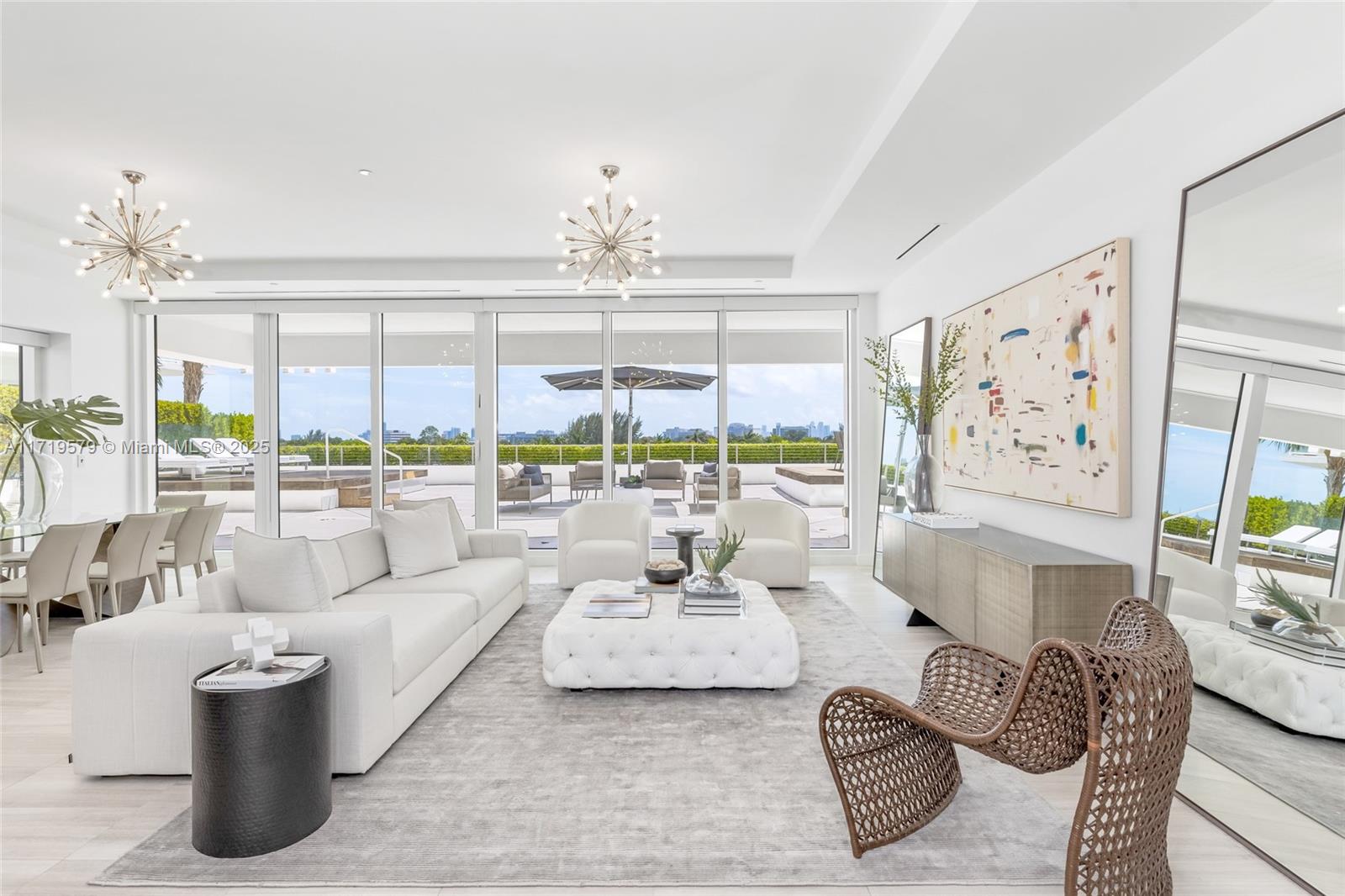 Enjoy this ONE OF A KIND RESIDENCE with 2,000+ SF of private outdoor terrace space at The Ritz Carlton Residences, Miami Beach. Your new home also boasts a private summer kitchen & your own jetted jacuzzi. This 2 bed/2.5 bath residence features a private elevator, custom build-out closets + Lutron blackout window treatments in every room. Chef’s kitchen featuring all Gaggenau SS appliances + gas range. Zucchetti fixtures & Boffi bathrooms throughout. Primary bath has a luxurious oversized glass-enclosed rain shower. This full-serviced building managed by The Ritz Carlton has an abundance of amenities including a marina, spa, rooftop restaurant, pool deck, club room, black car service & more!