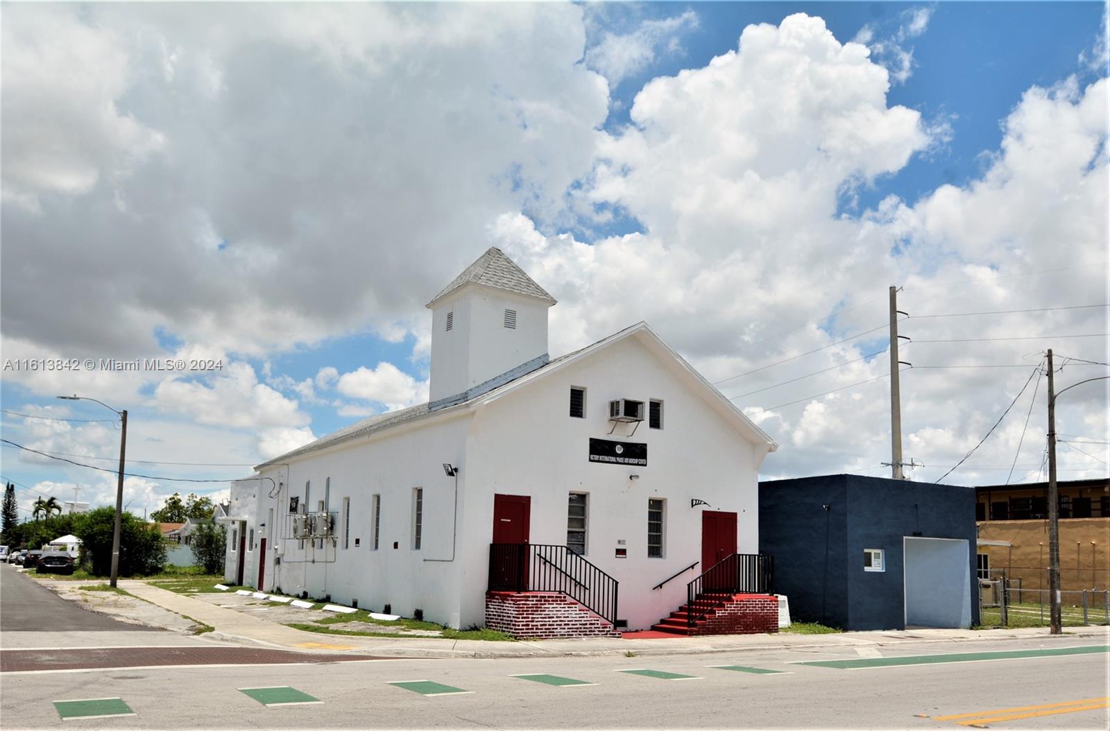 Located just across the street from the newly constructed Townhomes of Liberty Square. This unique free-standing structure, built and currently used as a church, is within the T4-L zone allowing for multiple uses including General Commercial, Multi-Family, Food Service, Office etc. Also located within a Community Opportunity Zone. 5 parking spots plus street parking. New Roof and air conditioning. 2 bathrooms, kitchen, office & party room. Mezzanine balcony of approximately 400sf currently closed & in need of flooring repair. As per the survey (attached) the lot extends 5 feet beyond the north wall of the building.
Located on the highly visible corner of NW 15 Ave & NW 66th Street, Liberty City in the heart of Miami.