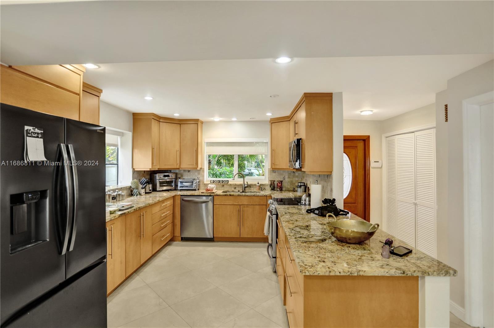 Boat lover's dream townhome in the gated community of Eastern Shores located just off of the intracoastal waterway. Beautifully updated throughout with open concept floor plan. Updated, spacious kitchen with granite counter tops. Hurricane impact windows recently installed. Spectacular water views from the main patio deck and master bedroom balcony won't disappoint. 2 assigned parking spaces. Community pool. Close to beach, restaurants, Aventura Mall and so much more.