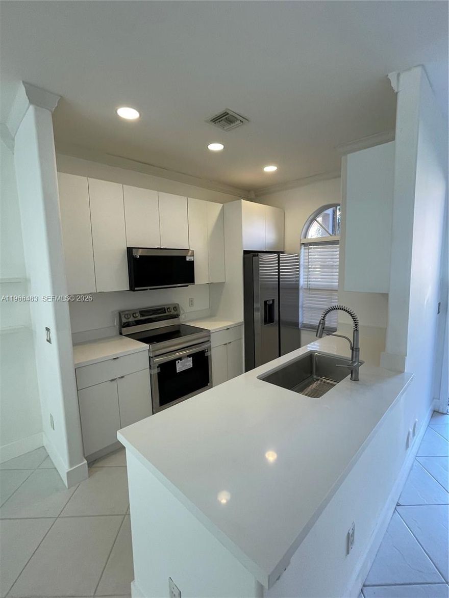 Experience high-end living in this completely remodeled, turn-key home! This stunning property features a chef-inspired kitchen with brand-new cabinetry, elegant quartz countertops, and a full suite of new stainless steel appliances, including an in-unit washer and dryer. 
The interior has been meticulously updated with fresh paint throughout, modern bathroom vanities, and stylish new lighting. Enjoy the sleek feel of newly installed stairs and pristine, pressure-washed outdoor spaces perfect for relaxing on your private patio. This move-in-ready gem offers the perfect blend of modern luxury and comfort. Schedule your tour today!