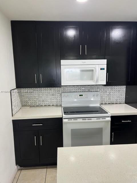Spacious 2?bed/2?bath condo in gated Casa?Bella. Features tile floors, central AC, dual balconies, secure entry, common laundry, and assigned parking.