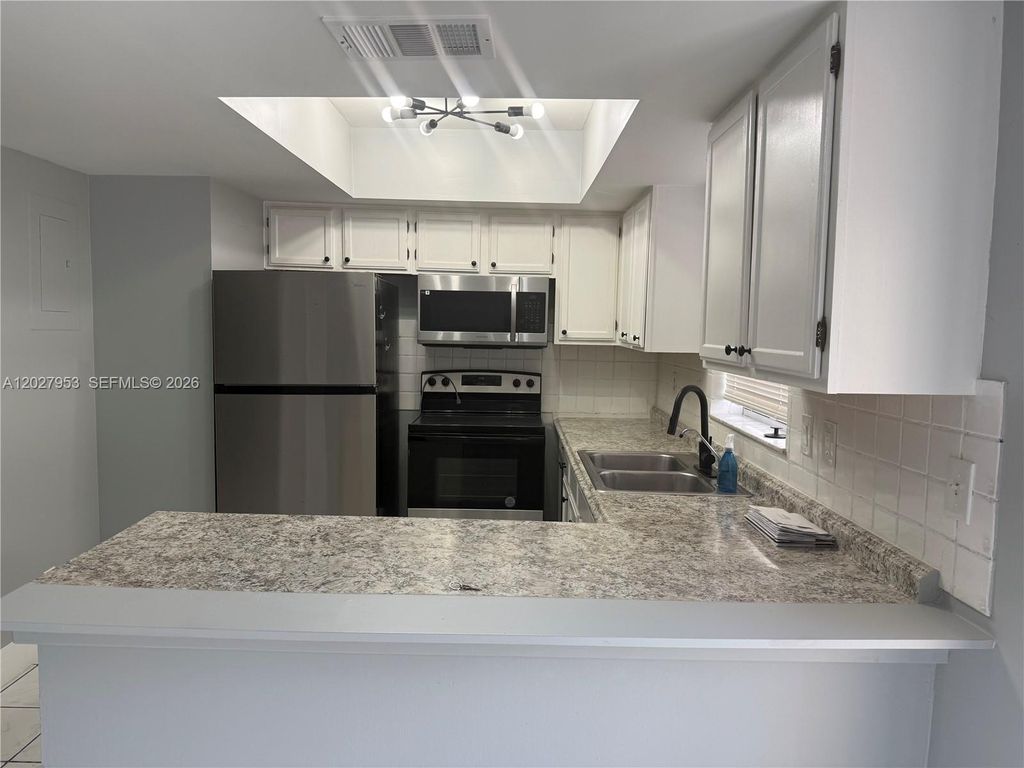 Photo of 7926 Kimberly Blvd #202, North Lauderdale, FL 33068 (MLS # A12027953)