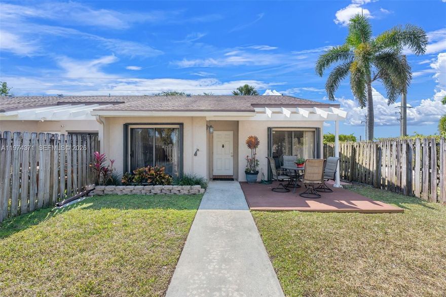 Let your creativity shine with this home.  Super clean 2 Bedroom/2 Bathroom ALL AGES, PET FRIENDLY, fully fenced end unit in The Lakes HOA.  Pull into your own private driveway that fits up to 3 vehicles and there's plenty of guest parking near by.  The front yard has a deck for outdoor dining and if you have a green thumb, this yard is for you!  Inside there's 1350 square feet under air per BCPA. Vaulted ceilings make this feel even larger.  Tile floors through out.  Large eat in kitchen with full size pantry. Enjoy the natural light pouring in through every window. Accordion shutters on windows.  Both bedrooms have an en suite bathroom and walk in closets. Bathrooms have updated showers by Bathfitters in 2021.  Primary bath has a newer vanity.  AC 2022.  Washer and dryer have their own space in the enclosed patio.  Washer is one year old.  Easy access to I95 and the Turnpike.  Close to shopping and house of worship.  All types of financing available.  Low HOA.