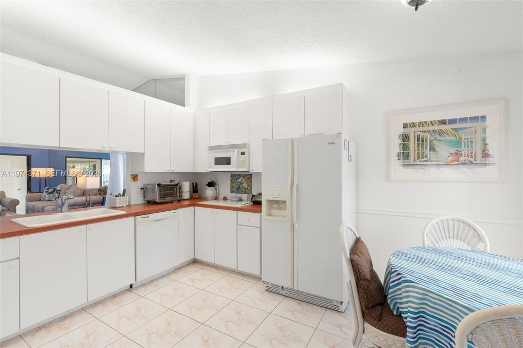 Photo of 1064 E Lakes Dr, Deerfield Beach, FL 33064 (MLS # A11974371)