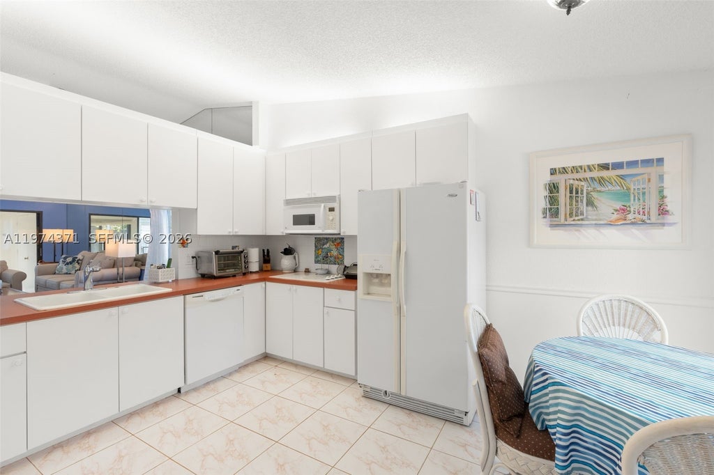 Photo of 1064 E Lakes Dr, Deerfield Beach, FL 33064 (MLS # A11974371)