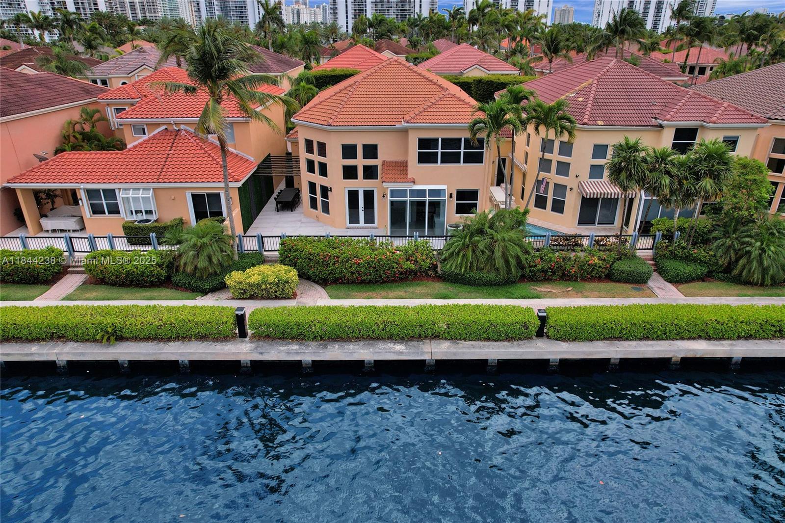 Only home available on the water in Island Way. Bright 2-story single family home. Remodelled, 5 bedrooms, 3 baths, family room. Vaulted ceilings, floor to ceiling impact windows. Open & spacious floor plan. Living, dining room, wine cellar. 1 bedroom downstairs. Spacious patio. Guard gated waterfront community with only 84 homes. Boardwalk surrounding the marina, with ocean access. Boater’s dream. Walk to shopping, restaurants, Waterways shops & houses of worship. Great School District. Community pool area and playground.