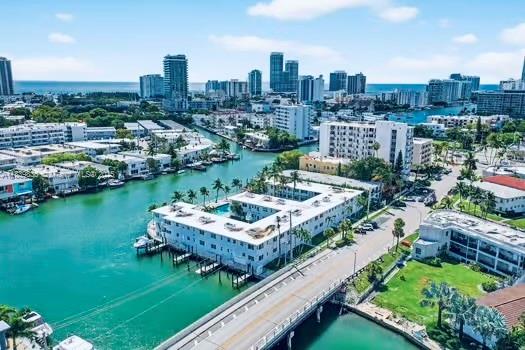 Unmatched Views & Lifestyle in the Heart of North Beach! This generous 2Bed / 1Bath floor plan unit offering: impact windows and doors, central A/C, in-unit washer/dryer, views and brand-new flooring throughout. This secured boutique building offers lovely green courtyards, charm and expansive views to the serene Tatum Waterway with direct access to Biscayne Bay , Pool and BBQ pavillion- perfect for gatherings. Take a short walk/bike to Beach and enjoy rapidly transforming North Beach (NoBe) neighborhood, with its numerous vibrant parks, cafes, restaurants, local shops, scenic beachfront boardwalk and blocks away from new 72nd Street Community Complex featuring a new library, aquatic center, gym, and skate park. A great opporunity awaits you in this attractive urban beachfront community