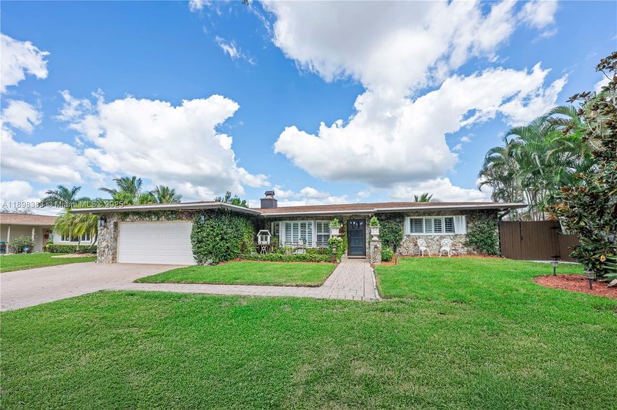 Just Listed in Pembroke Lakes! Discover this enchanting 3BD/2BA, 2,652 sq ft single-family home with NO HOA, set on a lush, oversized lot with serene lake views. Enjoy a screened pool, outdoor kitchen, and real wood-burning fireplace. Interior features include Red Dot KitchenAid appliances, a built-in coffee bar, plantation shutters, impact windows, accordion shutters, and a 2021 roof. The spacious office with its own mini-split AC is ideal for remote work or a playroom. Fruit trees, stone accent walls, and negotiable furnishings add charm. Located near A-rated schools, CB Smith Park, Pembroke Lakes & Gardens Malls, and major highways—this is South Florida living at its finest!