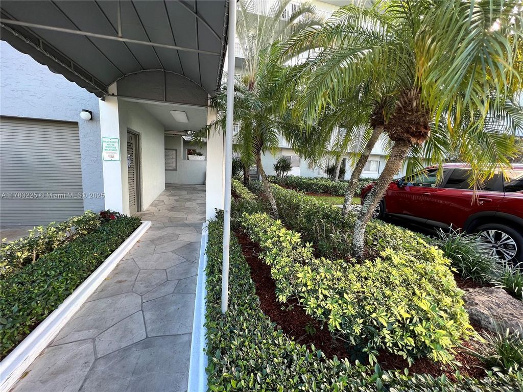 Photo of 2220 N Cypress Bend Dr #401, Pompano Beach, FL 33069 (MLS # A11783225)