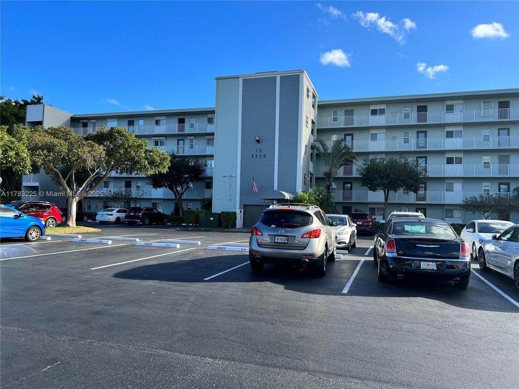 Photo of 2220 N Cypress Bend Dr #401, Pompano Beach, FL 33069 (MLS # A11783225)