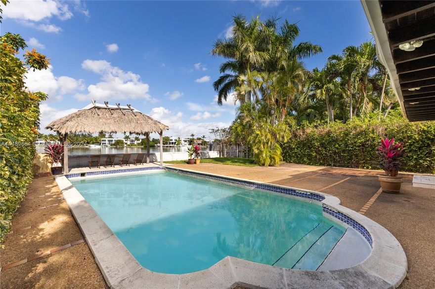 Wide views of Biscayne Bay and glamorous Indian Creek greet you upon entering 901 Stillwater Drive. Nestled on one of Biscayne Point's peninsulas, this elite enclave attracts a private crowd seeking tranquility and unobstructed water access with no fixed bridges. The home sits on 50ft of water frontage with a newly capped bulkhead. The spacious interior has multiple living areas, 3 large bedrooms and a smaller 4th bedroom that can be used as a den or office. An older home with renovations required, this purchase is ideal for someone looking for an attractive entry point on the waterfront with an appetite to upgrade or build. Some renderings are included in the listed photos and architectural plans are available for interested parties.