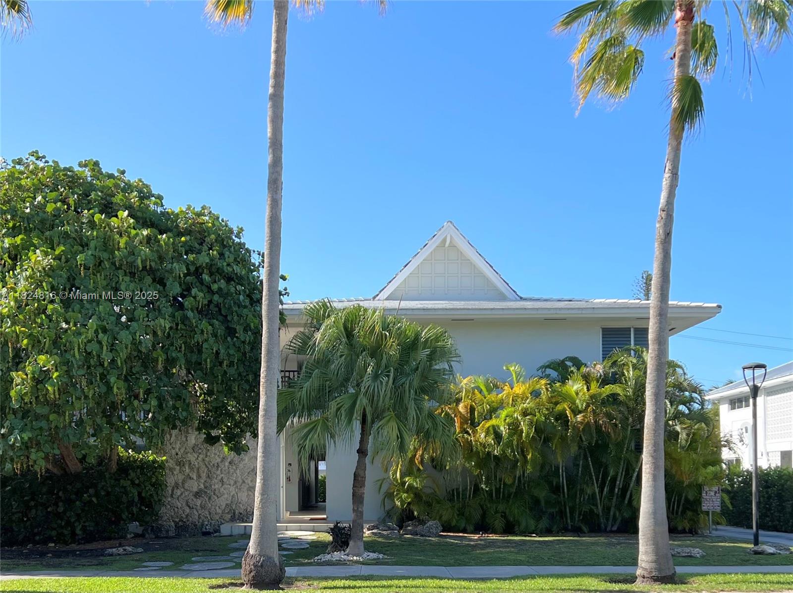 Rarely available lanai with direct pool access in a charming 10-unit beach-cottage-style building. this bright SW corner unit has been fully renovated with white floors and impact windows. Enjoy a private porch by the pool, modern kitchen with stainless steel appliances, updated bathroom, in-unit washer, and free laundry in building. Offered furnished with select pieces, as seen in photos. Long-term rental. Just steps from the beach, parks, shops and restaurants. Assigned parking included-your perfect Key Biscayne retreat!