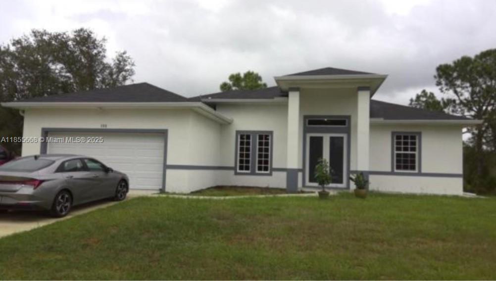 Discover modern elegance in this brand-new 4-bedroom, 3-bath home in a prime Lehigh Acres, FL location. Featuring impressive 15’ and 10’ ceilings, it offers an airy ambiance with spacious living areas flowing to a gourmet kitchen and dining space, perfect for gatherings. Custom shower tiling adds luxury, while the primary suite boasts a spa-like bath and walk-in closets. Three additional bedrooms provide flexibility for guests, office, or hobbies. A long driveway enhances curb appeal and offers ample parking, and the landscaped yard invites outdoor living. Conveniently close to schools, parks, amenities, and major routes, this home blends modern luxury with functional design. Schedule your showing today.