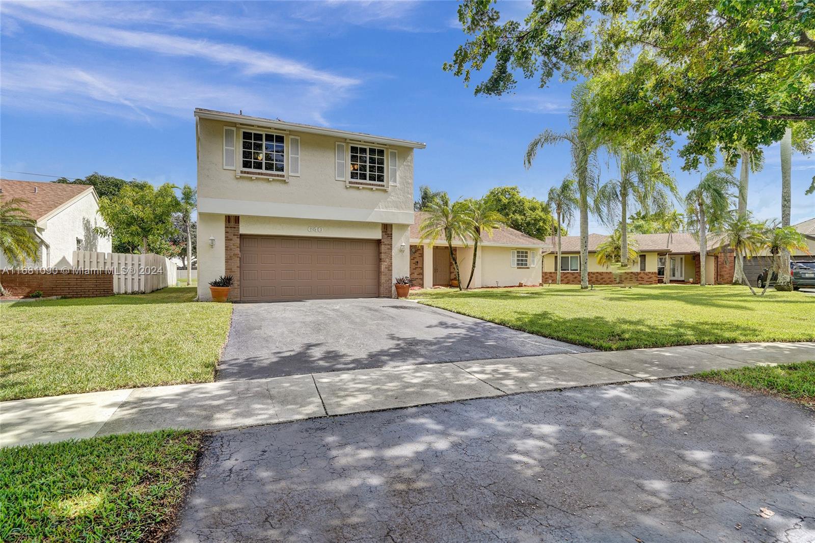 Discover this beautifully maintained family home in the highly desirable Shenandoah community of Davie, FL. This light-filled residence offers 4 spacious bedrooms, 2.5 bathrooms, and a 2-car garage. The primary bedroom is conveniently located on the first floor, with 3 additional bedrooms and a full bathroom upstairs. The updated kitchen features soft-close white cabinets, quartz countertops, stainless steel appliances, and a solar water heater. Outside, the large, well-manicured yard has plenty of space for a pool. Ideally located near Shenandoah Park with playgrounds, sports courts, and a kids' water park. Close to highways, top schools, shopping, dining, and entertainment. A fantastic opportunity to make this your home!