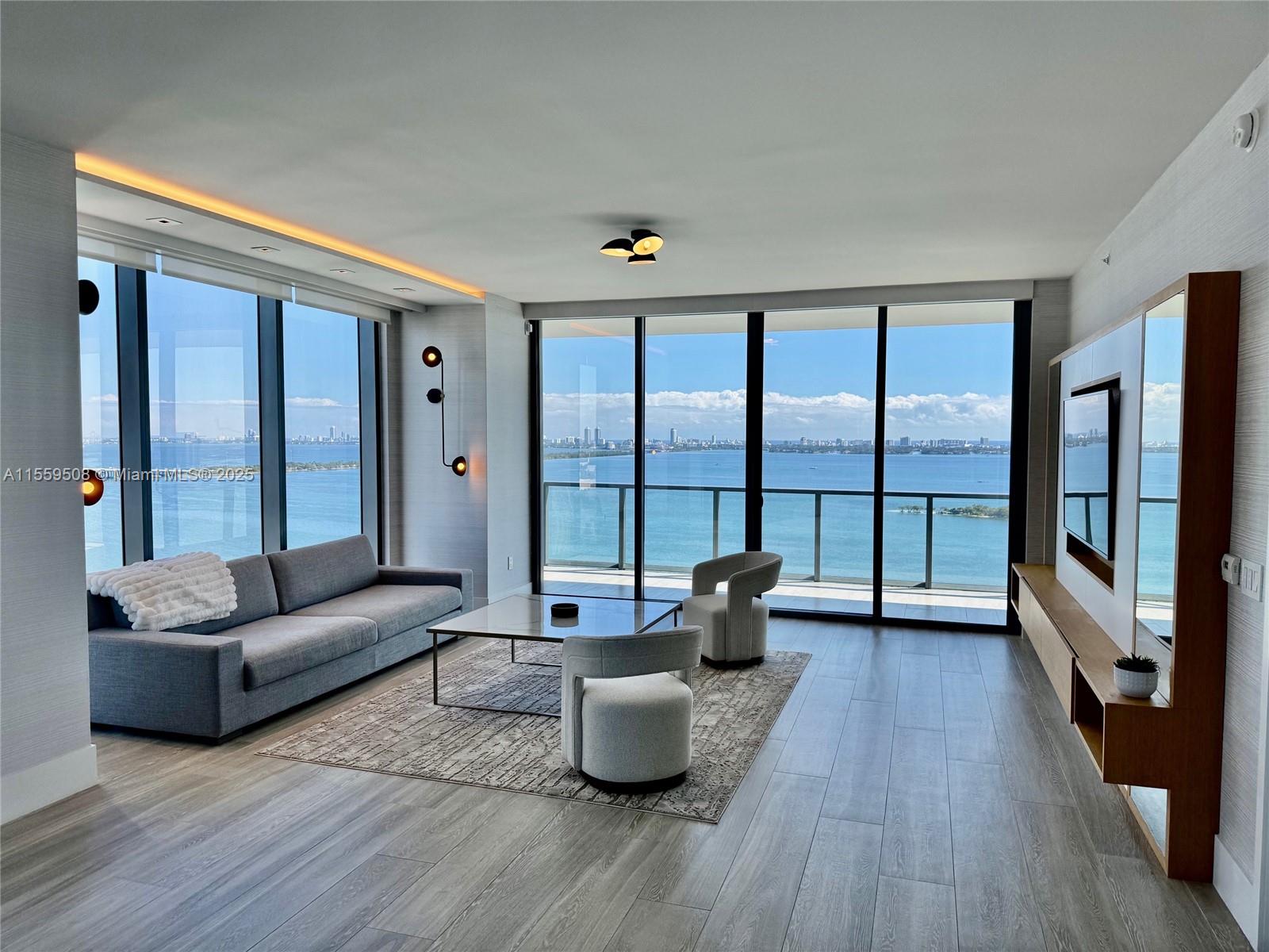 Welcome to luxury waterfront living at the sophisticated boutique Elysee, located in prime Edgewater. This 3-bed - 4.5-bath + sunset den (possible 4th bedroom) residence is a beautiful flow-through unit with breathtaking views from your sunrise and sunset terraces. This unit offers custom designer built ins, porcelein floors throughout, along with motorized blackout blinds for the 10' floor to ceiling windows throughout. The Elysee offers its residents 5 star concierge services, along with first class amenities including sunrise and sunset pools, fitness center, spa, sky lounge, library, screening room, business center, butler and more. Private elevator entrance into your unit, and only two units per floor.Truly an exquisite offering that is vacant and ready for your luxury clients needs.