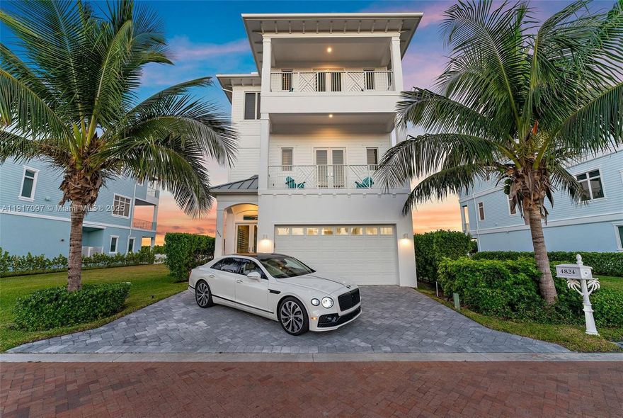 Experience coastal luxury and refined living in this stunning oceanfront home offering breathtaking views of both the Atlantic Ocean(sunrise) and intra-coastal waterway(sunset).This 4 bedroom 5.5 bathroom home boasts high ceilings, an open floor plan, and over-sized flex space on the first floor. Kitchen is designed for entertaining with its enormous center island(seating for 6),Thermador gas cook-top, double ovens, and Wood-Mode cabinetry. Numerous balconies wrap this home, including one with warm ocean breezes and lighted spa designed for four. This home is equipped with an elevator, solid concrete construction( including all interior floors), Andersen impact windows/doors, and standing seam aluminum roof. Designed for minimal maintenance; built by Coastal Construction and Design.