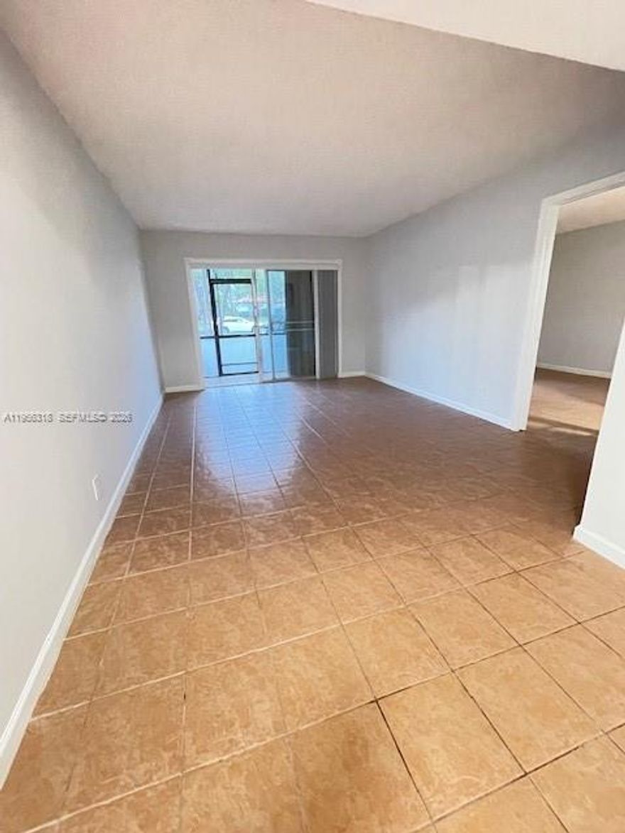 FIRST FLOOR CONDO IN A QUIET COMMUNITY CLOSE TO 95, FAU , SHOPPINGS , SCHOOLS AND MORE ! RENOVATED -- NEW BATHROOMS , NEW AC AND WATER HEATER ! HURRY!