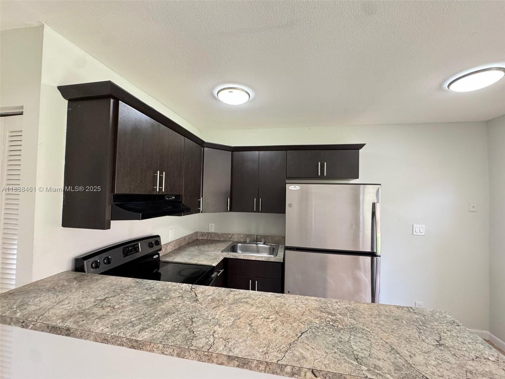 Photo of 101 NE 41st St #G111, Oakland Park, FL 33334 (MLS # A11838461)