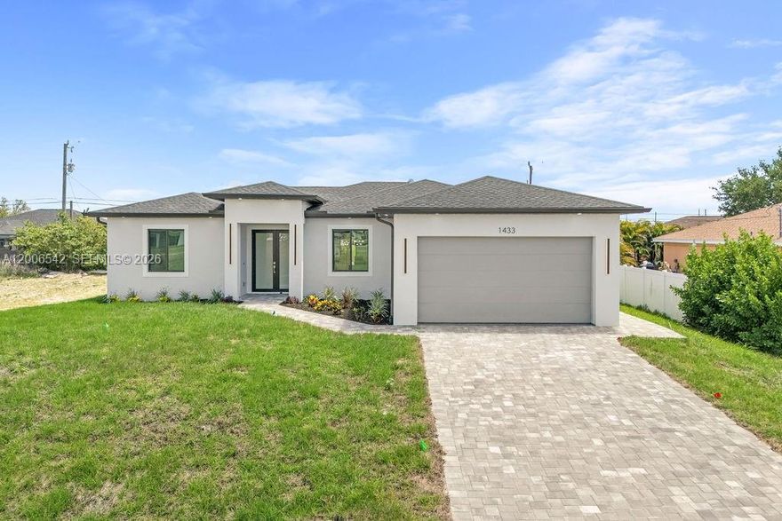 Welcome to this new construction home in NW Cape Coral, located in a quiet and growing area just minutes from shopping, restaurants, and main roads like Diplomat Pkwy and Pine Island Rd. This property features 3 bedrooms, 2 full bathrooms, plus an additional half bath designed for future pool access. With 1,532 square feet under air and 2,009 total, the layout feels open and functional, enhanced by elevated ceilings and tile flooring throughout. As you walk in, you’re welcomed by a modern kitchen finished with quartz countertops, included appliances, and a built-in wine cooler, all flowing seamlessly into the main living space. The bathrooms continue that same clean look with quartz finishes and lighted mirrors, while the closets come ready with built-out hanging systems for convenience. Outside, the home offers a paver driveway, epoxy-coated garage floors, and a backyard already prepared with space for a future pool, making it easy to create your own outdoor setup. The laundry room also includes a utility sink, adding practicality to the home’s design. This is a solid option for anyone looking for a clean, modern home in an area that continues to grow. Priced to sell, and it won’t last long. If you’d like more information or want to schedule a showing, reach out.