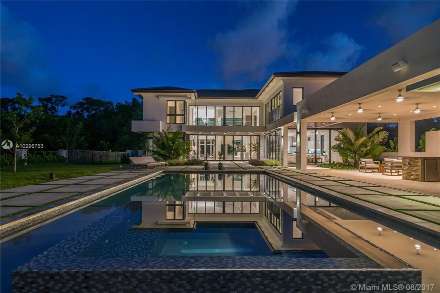 Completed in July of 2017, this new construction contemporary masterpiece is fully gated for ultimate privacy, and meticulously designed with superior finishes. Soaring ceilings with walls of glass integrating the indoor and outdoor spaces welcome you as you enter this magnificent home. Property features include Mia Cucina Italian designed kitchen cabinetry and vanities, smart home technology and Lutron systems, elevator, resort style professionally landscaped grounds with a gorgeous heated pool, fully equipped outdoor kitchen, adjacent guest quarters/gym with full bath. Centrally located within close proximity to nationally ranked schools, parks, shops and restaurants. Perfect home for entertaining family and friends.