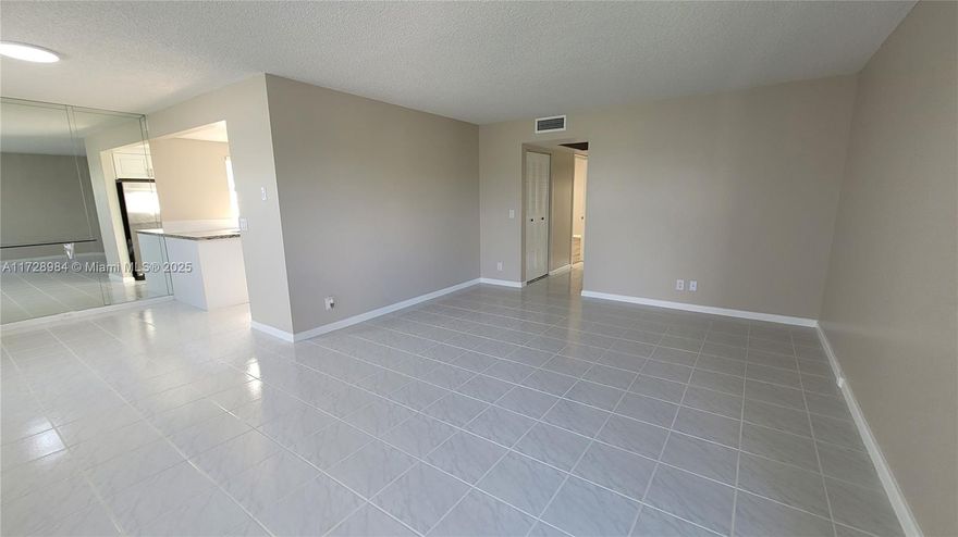 Century Village 55+ | Investor-Friendly – Rent Immediately! Fully renovated corner unit with stunning lake views. This 2-bed/2-bath features a modern white kitchen with soft-close cabinets, stainless steel appliances, and granite countertops. Freshly painted, with updated bathrooms, new window screens, and shades. Tile flooring in main areas, vinyl in bedrooms, and a screened-in porch. Laundry facilities on the floor. Century Village offers a million-dollar clubhouse, golf, tennis, pools, theater, bus transportation, 24-hour security, and more. Centrally located in Pembroke Pines near highways, shopping, and restaurants.