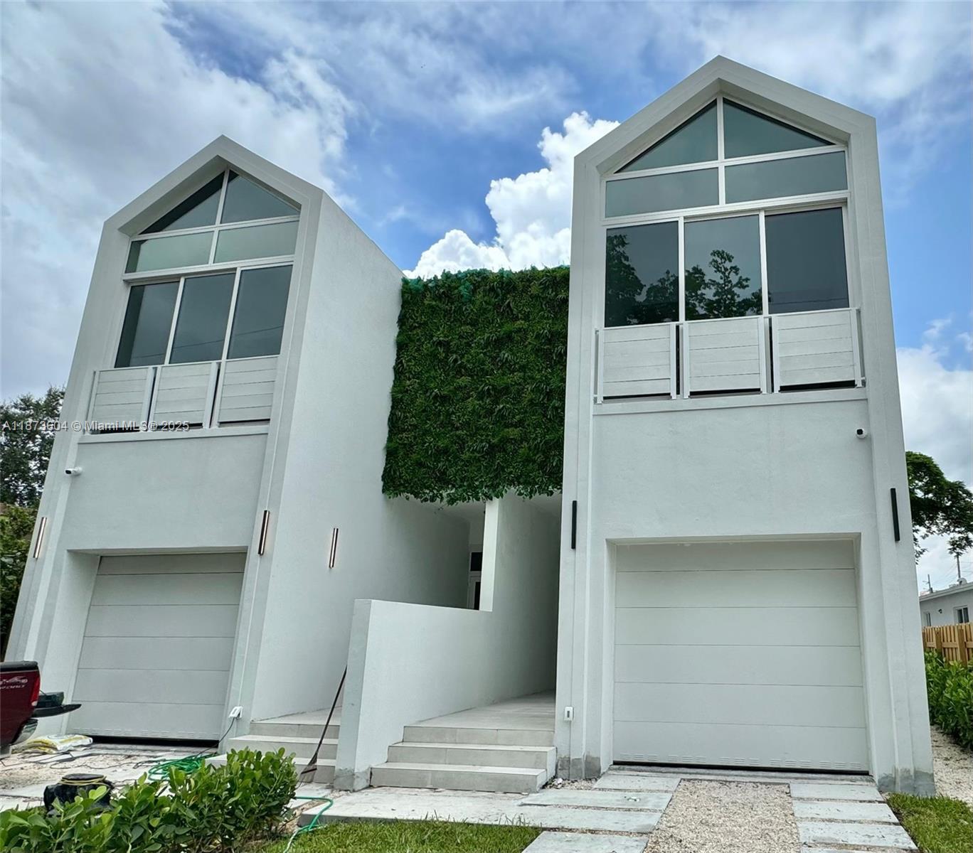 5728 NW 5th Court presents a brand-new luxury duplex in Miami’s College Park/Little Haiti neighborhood. Each unit offers approx. 2,484 SF of modern design with 3 beds, 3.5 baths, polished concrete balconies, wood-look porcelain tile floors, European-style cabinetry, quartz countertops, and floor-to-ceiling impact glass windows. Smart home features include automated lighting, security systems, cameras, central A/C, and garage integration. Listed under one folio as Residential Income (Duplex), this offering appeals to both owner-occupants and investors seeking a sophisticated property in the heart of Miami’s most vibrant emerging district: Wynwood, Design District, and Brickell minutes away