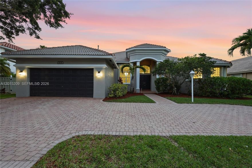 Highly desirable Monterey model in sought-after luxurious Pembroke Falls, with 4 bedrooms + an office that can easily be a 5th bedroom, along with 3 full bathrooms. This beautiful single-story home offers BRAND NEW VINYL FLOORING that flows all throughout the home’s functional OPEN-CONCEPT LAYOUT. The TASTEFULLY UPDATED KITCHEN features NEW CALACATTA QUARTZ COUNTERTOPS, NEW STAINLESS-STEEL APPLIANCES, and refreshed cabinetry. The VOLUME CEILINGS and LARGE WINDOWS bring in an abundance of natural light to create an inviting atmosphere this is carried into the SPACIOUS PRIMARY SUITE. Step outside to an EXPANSIVE PATIO with a HEATED POOL and SERENE LAKE VIEWS, providing an ideal setting for both relaxing and entertaining. Additional highlights include a CIRCULAR DRIVEWAY and ACCORDION SHUTTERS. Pembroke Falls is a RESORT STYLE GATED COMMUNITY with a STATE OF THE ART CLUBHOUSE that features a pool, tennis courts, pickleball courts, basketball courts, gym, and more! The community also offers NATURAL GAS to its residents. The HOA includes Cable, Fiber Optic Internet, Alarm System, 24 hour security, AND SO MUCH MORE!