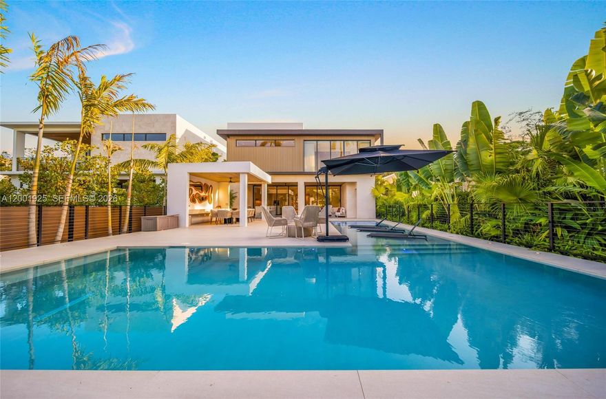 Private waterfront estate in Miami's prestigious Belle Meade gated community, offers exceptional privacy and security. This newly built residence features 5 bedrooms and 7.5 bathrooms, an expansive 7,200 square-foot villa with entertaining spaces and beautifully designed by a famous interior decorator.  The property includes a private fitness room, children's playroom, and dedicated staff quarters. Outdoor spaces are designed for true Miami waterfront living, with a resort-style pool terrace, lush landscaping, and boat-ready dock, and a short direct water access to the bay with no fixed bridges. The house is fully furnished and turnkey, this exceptional property combines privacy, security, and all the high-end luxury features for an unforgettable stay! Situated on Biscayne Bay, just minutes away from Miami Beach, Design District, and Miami's top restaurants, shopping, and cultural destinations, perfect for high-profile events like the 2026 FIFA World Cup.