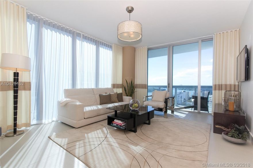 Beautifully finished and furnished turn key corner unit in prestigious North Tower at Carillon Miami Wellness Resort. Custom designed Interiors by Steven G unit, including motorized shades in bedroom. Stunning sunset, bay and city views. 70,000 square foot fitness spa center, 4 pools, salon, concierge, restaurant, poolside cafe, bar, 24hr sec, valet, wellness staff, beach service. All amenities, classes 7 days a wk included. Min 6 mos required. $2,700 per mo off season. $3,600 per mo for annual lease.