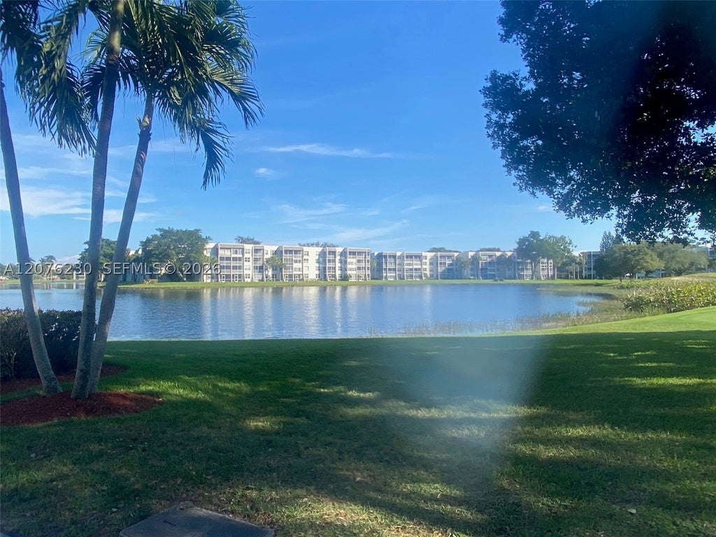 Photo of 9420 Poinciana Pl #214, Davie, FL 33324 (MLS # A12076230)