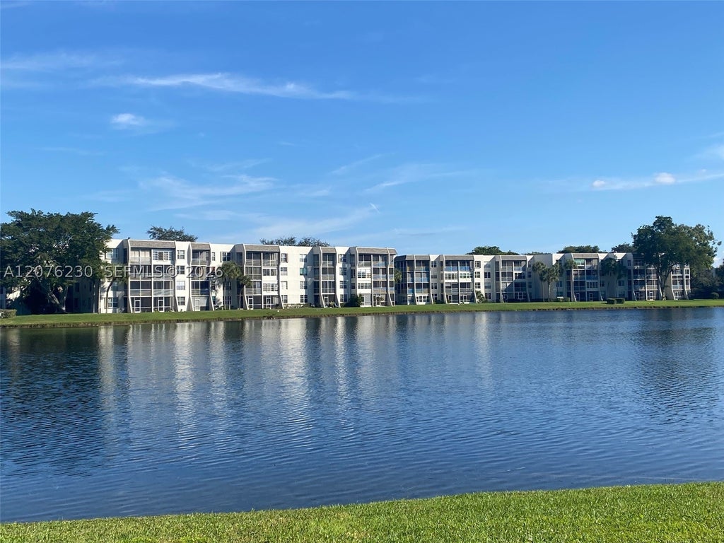 Photo of 9420 Poinciana Pl #214, Davie, FL 33324 (MLS # A12076230)