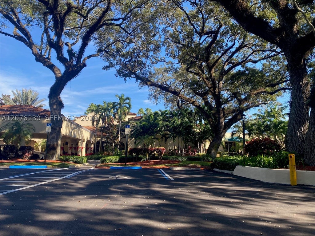 Photo of 9420 Poinciana Pl #214, Davie, FL 33324 (MLS # A12076230)
