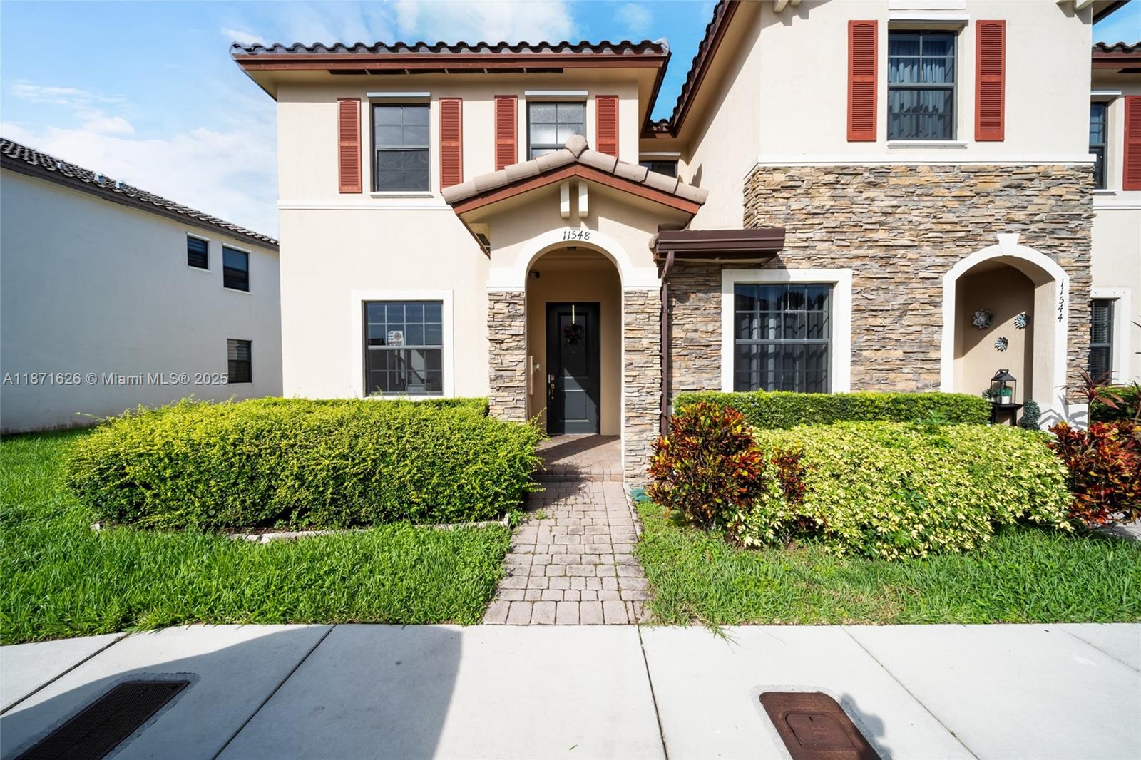 Remarkable Townhome in Garden Estates at The Hammocks! Don’t miss out on this incredible opportunity to own a charming corner townhome! Built in 2015, this property features two spacious en suite bedrooms on the second floor, offering both comfort and privacy. The open layout combines a generous living room and family room with a well-appointed kitchen, making it the perfect starter home for a new family.Convenience is key with two assigned parking spaces included. Step outside to the inviting back patio, complete with a lovely pergola, creating an ideal setting for entertaining family and guests. This amazing property won’t last long—schedule your visit today and see all that it has to offer!